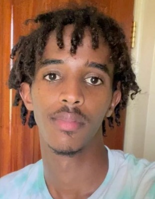 Adan Jama current passport photograph