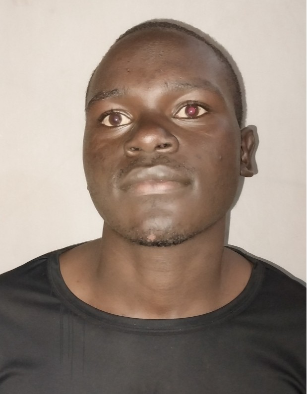 AUGUSTINE KISONGOCHI current passport photograph