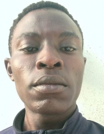 KEVIN ODAMNA current passport photograph