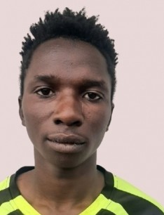 Reagan Migasha current passport photograph